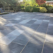 Warm low-voltage garden lighting on brick steps and walling at dusk